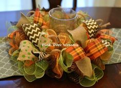 a close up of a table with a cup and some decorations on top of it