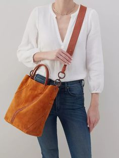 The perfect tote for fall. Fall Rectangular Bucket Bag For On-the-go, Cognac Bucket Bag For On-the-go, Cognac Bucket Bag With Handle Drop, Fall Bucket Satchel With Removable Pouch, Fall Shopping Bucket Bag, Fall Leather Bucket Bag, Luxury Bucket Bag With Removable Pouch For Fall, Modern Bucket Satchel For Fall, Fall Bucket Bag With Detachable Handle For Daily Use