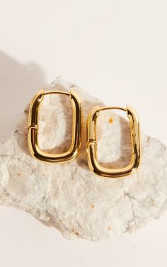 Add a touch of glamour to any outfit with our Toni Earrings in Gold. These stunning hoop earrings are perfect for both casual and party looks, making them a versatile addition to your jewelry collection. Crafted in gold, these earrings exude elegance and sophistication, while the classic hoop design adds a trendy twist.Whether you're heading out for brunch with friends or getting ready for a night on the town, our Toni Earrings are sure to elevate your style game. So go ahead and shine bright wi Trendy Gold-tone Hypoallergenic Earrings, Trendy Gold Dangle Hoop Earrings, Trendy Hypoallergenic Gold-tone Earrings, Trendy Gold Plated Pierced Earrings, Elegant Small Hoop Gold Plated Clip-on Earrings, Trendy Hypoallergenic Gold Earrings, Trendy Gold-tone Hoop Earrings Gift, Trendy Gold-tone Jewelry With Matching Earrings, Trendy Gold-tone Gold Plated Earrings