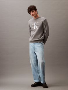 Styled in an oversized silhouette, this crewneck sweatshirt is made with drop shoulders for a relaxed fit. Crafted from a cotton fleece blend for soft, plush comfort. Detailed with banded cuffs at the sleeve openings and features a CK monogram logo design at the front.  Material: 80% Cotton, 20% Polyester. Calvin Klein Crewneck, Calvin Klein Crew Neck Sweatshirt With Ribbed Cuffs, Calvin Klein Relaxed Fit Sweatshirt With Ribbed Cuffs, Ck Monogram, Calvin Klein Crew Neck T-shirt With Logo, Calvin Klein Relaxed Fit Crew Neck T-shirt, Monogram Logo Design, Oversized Silhouette, Cotton Fleece