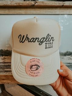 Stylish and fun, the "Wranglin' Kids Hat" adds boho western flair to any outfit. Perfect for adventurous families. Shop The Bevel Label now! All Hat No Cattle, Cowboy Hat Trucker Hat Outfit, Womens Hunting Hat, Western Outfit Accessories, Western Themed Gifts, Brand Merch Ideas Products, Outfit With Trucker Hat, Baseball Mom Trucker Hat, Women Trucker Hat