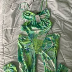 New Side Cut Out Jumpsuit With Adjustable Straps. Runs Slightly Larger Than Normal Sizing. Green Stretch Jumpsuits And Rompers For Spring, Fitted Green Jumpsuits And Rompers For Beach Season, Fitted Green Jumpsuit, Fitted Green Jumpsuits For Beach Season, Green Stretch Jumpsuits And Rompers For Vacation, Green Stretch Jumpsuit For Vacation, Spring Green Printed Bodysuit, Green Printed Jumpsuits And Rompers For Beach Season, Green Fitted Sets For Vacation