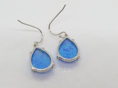 Vintage Sterling Silver Pear cut Blue Opal Dangle Earrings...Marked 925...Total of weights 3.5grams...Measure H 1 2/8'' W 1/2''...These are in very good condition. Blue Teardrop Pendant Earrings As Gift, Blue Sterling Silver Teardrop Earrings Nickel Free, Blue Sterling Silver Teardrop Jewelry, Blue Sterling Silver Teardrop Earrings For Gift, Blue Teardrop Sterling Silver Jewelry, Nickel Free Blue Teardrop Pendant Earrings, Blue Hallmarked Drop Earrings, Hypoallergenic Blue Teardrop Jewelry, Blue Pear-shaped Earrings For Gift