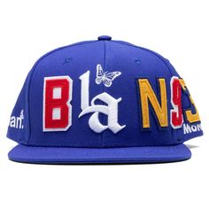 BAN's headwear line speaks rebellion and self-expression. Crafted with a low-profile silhouette in Wool Acrylic, it offers a versatile Snapback Closure for a universal fit. Each cap features custom labels, stickers, and intricate embroidery showcasing the "BAN" and "MON" logos. The 3D front logo and back panel embroidery complete the statement, while 2-ply felt patches spell out the "BAN" acronym, encapsulating the brand's ethos in every stitch. Wool Acrylic Build Low Profile 3D Embroidered Fron Felt Patches, Streetwear Hats, Felt Patch, Profile Silhouette, Custom Caps, Concept Clothing, Patches Fashion, Street Fashion Men Streetwear