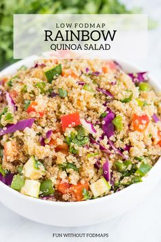 a white bowl filled with rice and veggies on top of a colorful table cloth