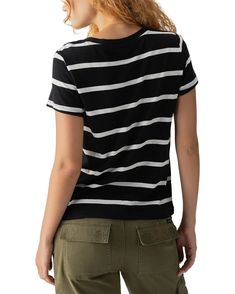 The Perfect Stripe Tee is your new go-to for effortless style. With its simple off white and black stripe knit, this basic tee is perfect for everyday wear. Pair it with your favorite denim and sneakers for a relaxed yet stylish look. Keep it simple, keep it perfect. Off white and black stripe knit Relaxed fit Crew neck The material is 51% Cotton 49% Rayon. The t-shirt runs true to size. The model is 5'10" and is wearing a size small. Care instructions: Machine wash cold, Dry flat Everyday Pants, Stripe Tee, Sweater Tank Top, Keep It Simple, Basic Tee, Dress Trousers, New Tops, Bottom Clothes, Clothes Collection