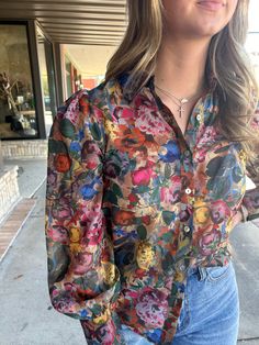 This Silvia Floral Blouse is the perfect addition to your wardrobe. With a lady like floral design, this top is versatile for both work and play. The high-quality material and expert craftsmanship make it a great choice for any occasion. A must-have for any fashion-forward individual looking to elevate their style. Chic Multicolor Blouse For Fall, Silk Button-up Tops For Fall, Elegant Floral Print Office Tops, Elegant Multicolor Floral Print Shirt, Fall Silk Button-up Tops, Fitted Printed Blouse For Workwear, Summer Silk Shirt With Floral Print, Feminine Floral Print Blouse For Daywear, Feminine Floral Print Button-up Shirt