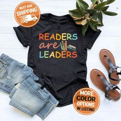 Readers Are Leaders Shirt, Reading Teacher Shirt, School Librarian Tee, Book Lover T-shirt, One More Chapter, Librarian Shirt, Readers Gift Welcome to Shirtsly Apparel. You're one stop location for all your shirt and gift needs. We use ultra soft tees made with the highest quality fabrics for your comfort and happiness. We print all of our shirts with the latest technology printing techniques to bring you the best color designs that last the longest. Products 🤩 - Handmade in the USA. Designed and shipped from our warehouse in Texas. - Solid colors are 100% airlume combed ring-spun cotton. - Heather colors are 52% cotton a& 48% poly mix. - Durable, extremely soft, stylish, vibrant colored and made in ecofriendly process. Size Questions? 🤔👚 Our shirts are Unisex style. This is in between Librarian Shirts Elementary, Summer Bookish T-shirt With Letter Print, Bookish Cotton T-shirt With Letter Print, Summer Graphic Print Bookish T-shirt, Bookish Crew Neck T-shirt With Funny Print, Bookish T-shirt With Funny Print And Short Sleeves, Bookish T-shirt With Funny Print For School, Bookish Letter Print T-shirt For School, School T-shirt With Letter Print In Bookish Style