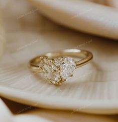 an engagement ring with two pear shaped diamonds