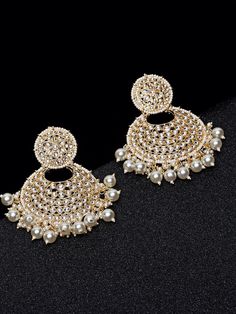 These exquisite gold-toned 2-layer crescent chandbali earrings come with kundan stone studs & beads, are gold-plated, and are secured with a post and back closure. These handcrafted chandbalis can be styled with any ethnic outfit for a dramatic impact, or an evening outfit to complete a dazzling look. Eitherway, complements are all yours! Product color may vary based on the monitor or screen you are using.See FAQ for more details. Size Length: 8.5 cm Details Material: BrassStones: Kundan & Artif Gold Heavy Chandbalis For Diwali, Gold Bollywood Chandbalis For Diwali, Metal Chandbalis For Diwali Wedding, Metal Chandbalis For Wedding And Diwali, Gold Chandbali Earrings With Latkans, Gold Metal Chandbali Danglers, Metal Chandbali Bridal Earrings, Metal Chandbali Bridal Earrings For Festivals, Gold Chandbali With Latkans