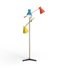 a floor lamp with three different colored lamps on the top and one light on the bottom