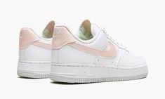 The Women’s Nike Air Force 1 Next Nature “White/Pale Coral” is a warm weather-inspired colorway of the popular lifestyle shoe constructed from at least 20% recycled content by weight.  From Nike’s Move to Zero initiative that aims to reduce the brand’s carbon footprint, the Air Force 1 Low Next Nature in “White/Pale Coral” features a white leather construction with a contrasting Pale Coral leather Swoosh.  Additional pink leather detailing is found on the tongue tag with “Nike Air” branding, and Coral Outfit, Leather Detailing, Nike Air Force 1 07, Stadium Goods, Air Force 1 Low, Carbon Footprint, The Vamps, Nike Air Force 1, Pink Leather