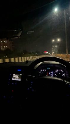 the dashboard of a car at night time