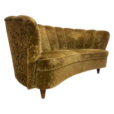 an old fashioned couch with gold and green fabric