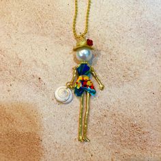 Ellies Belle: Toby French doll pendant by ElliesBelles on Etsy Bead Dolls, Beaded Dolls, Bead People, Beaded People, Long Beach Ny, Beachy Necklace, Ancient Egyptian Jewelry, Doll Necklace, Stick People