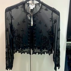 Beautiful, Detailed, Decorative, Black Sequin, Cover. Great For Formal, Fancy, Or Romantic Evenings. Elegant Black Festive Tops, Black Fitted Top For Wedding, Elegant Black Evening Top, Elegant Black Top For Evening, Fitted Black Top For Wedding, Elegant Evening Tops For Party Season, Black Spring Wedding Tops, Elegant Holiday Cocktail Tops, Festive Black Top For Night Out