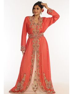 Peach Georgette Hand Zari Embroidery Party Wear Kaftan Right side and both sleeve zari work Back close with loop, button & zip, easy to wear Dress belongs to the zari embroidery work with glass stone at the front and sleeves Hijab and band shown in the image can be bought separately Fabric: GeorgetteCare: Mild machine wash/ hand Cold Wash/ Dry cleanWe request customers to carefully choose the correct size and dress length referring to our size chart Embroidered Orange Traditional Wear For Reception, Long Sleeve Embellished Kaftan For Diwali, Embellished Long Sleeve Kaftan For Diwali, Festive Semi-stitched Long Sleeve Kaftan, Diwali Embellished Long Sleeve Kaftan, Festive Long Sleeve Semi-stitched Kaftan, Semi-stitched Long Sleeve Kaftan For Festive Occasions, Semi-stitched Long Sleeve Kaftan For Festivals, Festival Semi-stitched Long Sleeve Kaftan