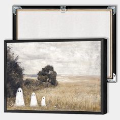 two white ghost figures in a field with trees and clouds behind them, framed art print on canvas