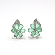 "Unveil the epitome of sophistication and grace with our remarkable Emerald Flower Earrings. Exquisitely crafted from the finest 92.5% purity sterling silver, these earrings are a celebration of refined design and masterful artisanship. With their delicately sophisticated design, they are destined to captivate hearts and elevate your style to new heights. A Flourish of Nature's Finest: At the heart of these earrings lies a mesmerizing floral motif, each petal painstakingly faceted with natural e Formal Gemstone Flower Earrings, Formal Flower Shaped Gemstone Earrings, Formal Flower-shaped Gemstone Earrings, Elegant Green Flower Earrings For Formal Occasions, Radiate Positivity, Earrings Emerald, Earring Cards, Diamond Flower, Emerald Gemstone