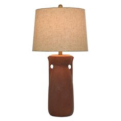 a brown ceramic lamp with a beige shade