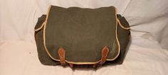 Vintage 1980's military green canvas 2 in 1 - backpack and shoulder bag. Measurements: H - 10'' [ 25cm.]                          W - 15 2/3'' [ 40cm.] / with side pockets /                       Side - 5'' [ 13cm.] One front pocket - H - 7'' [ 18cm.]                              W - 10'' [ 25cm.]                            Side - 2'' [ 5cm.] Two side pockets - each - H - 8 2/3'' [ 22cm.]                                          W - 5'' [ 13cm.]                                       Side - 2'' [ Green Vintage Satchel For Travel, Vintage Satchel For School, School Satchel With Canvas Lining, Vintage Green School Bag, Green Vintage School Bag, Military Style Canvas Satchel Bag, Vintage Backpack Shoulder Bag For School, Vintage School Backpack Shoulder Bag, Vintage Green Backpack For Everyday Use