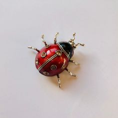 Red enamel ladybug rhinestone brooch. Sparkly and cute. Not intended for children ages 13 and under. Also, for many items we can accommodate large orders, so please send us a message. Red Enamel Brooch Pin For Gift, Red Enamel Brooch Gift, Red Enamel Brooch For Gift, Red Enamel Brooches As Gift, Red Enamel Brooches For Gift, Red Enamel Pins For Gifts, Silver Novelty Brooches For Gifts, Bug Pins, Ladybug Brooch