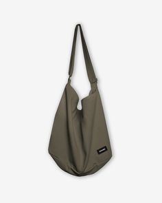 This vintage inspired high capacity tsuno bag is made from 100% cotton canvas material and features a slouchy fit. It features a large pocket with zip closure and interior open pockets. It is perfect to wear over the shoulder or across your body and can fit all your everyday essentials. 100% Cotton Adjustable strap One-size Large Capacity Khaki Cotton Shoulder Bag, Casual Everyday Hobo Canvas Bag, Casual Khaki Canvas Bag For Everyday, Solid Hobo Bag With Pockets For Daily Use, Solid Color Hobo Bag With Pockets For Daily Use, Casual Canvas Hobo Bag With Pockets, Casual Hobo Bag With Pockets For Everyday, Everyday Khaki Shoulder Bag With Zipper Pocket, Casual Shoulder Bag With Canvas Lining For Weekend