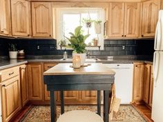 a kitchen with wooden cabinets and an island in front of the stove top oven is shown