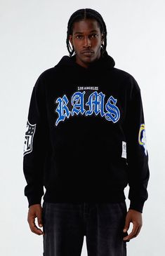 PacSun exclusive! Show off your Rams pride with the Los Angeles Rams Hoodie from NFL x Aleali May, designed for ultimate fan comfort. This hoodie features long sleeves, an attached hood, a kangaroo pocket, bold NFL team graphics on the front and back, NFL branding on the sleeve, and an NFL woven label on the front for a standout look.Solid color hoodieSoft fleece liningLong sleevesAttached hoodKangaroo pocketNFL graphicsNFL woven labelRibbed cuffs and hemStandard fit75% cotton, 25% polyesterMachine washableModel is wearing a size mediumModel Measurements: 6'2” Height, 30” Waist, 31” Chest, 34” Hips NFL x Aleali May Mens Los Angeles Rams Hoodie - Black size Medium Los Angeles Rams Outfit Women, Vintage Rams Shirt, Baltimore Ravens Hoodie, La Rams, Nfl Gear, Los Angeles Rams, Nfl Teams, Pacsun, Black Hoodie