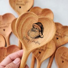 wooden spoons with santa claus engraved on them