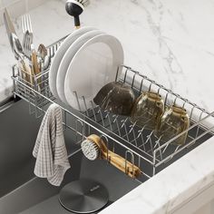 a kitchen sink with dishes and utensils in it