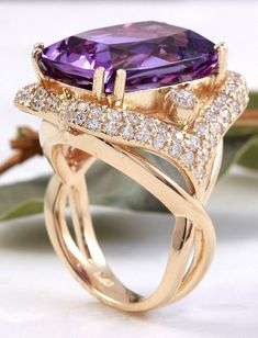 13.50 Carats Natural Amethyst and Diamond 14K Solid Yellow Gold Ring Suggested Replacement Value: $7,400.00 Total Natural Cushion Shaped Amethyst Weights: Approx. 12.00 Carats Amethyst Measures: 17.00 x 13mm Natural Round Diamonds Weight: Approx. 1.50 Carats (color G-H / Clarity SI1-SI2) Ring size: 7 (free re-sizing available) Ring total weight: Approx. 12.00 grams Disclaimer: all weights, measurements and colors are approximate and may vary slightly from the listed dimensions or as seen in the Elegant Amethyst Diamond Ring With Gemstone Accents, Elegant Purple Diamond Ring With Gemstone Accents, Yellow Gold Amethyst Diamond Ring, Fine Jewelry Yellow Gold Diamond Amethyst Ring, Fine Jewelry Yellow Gold Amethyst Diamond Ring, Luxury Purple Diamond Ring For Formal Occasions, Luxury Amethyst Rings With Gemstone Accents, Luxury Amethyst Ring For Anniversary, Luxury Amethyst Ring With Prong Setting