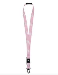 a pink lanyard with white hearts on the front and black clippings is shown