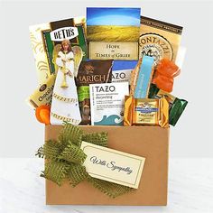 a box filled with lots of different types of food and snacks on top of a table