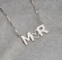 "This beautiful custom two letter necklace can serve as a symbol of the bond you share with your partner or represent two people that you hold close to your heart! A piece of personalized jewelry makes for a priceless keepsake. This double initial necklace be great as a gift for girlfriend, gift for mom, or wife gift. Please visit our store Wilder Girls for more sizes and styles. Thank you for supporting our family business! Details: - Personalize by choosing two initials for your necklace - Available in sterling silver, 24K gold plating over sterling silver, rose gold plating over sterling silver - Available box chain length: 14in, 16in, 18in, 20in, 22in - Available cable chain length: 14\"-16\", 16\"-18\", 20\"-22\"" Sterling Silver Initial Necklaces For Anniversary Gift, Silver Initial Necklace For Valentine's Anniversary, Sterling Silver Initials Name Necklace For Valentine's Day, Minimalist Initials Name Necklace For Anniversary, Silver Initial Necklace For Anniversary On Valentine's Day, Sterling Silver Initials Necklace For Anniversary, Personalized Sterling Silver Name Necklace For Anniversary, Valentine's Day Sterling Silver Initials Name Necklace, Sterling Silver Initial Necklace For Anniversary