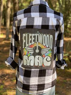 White and black buffalo plaid flannel features a sewn-on Fleetwood Mac graphic tee. Size: Men's XSmall/Women's Small Due to the upcycled nature of this item it is non-refundable, but it is sure to be a one of a kind! Not an official licensed product of Fleetwood Mac. Black Cotton Flannel Shirt For Spring, Fall Flannel Top With Graphic Print, Fall Cotton Flannel Shirt With Graphic Print, Upcycled Cotton Tops For Fall, Plaid Cotton Flannel Shirt With Graphic Print, Buffalo Plaid Flannel, Blueberry Desserts, Flannel Women, Desserts Recipes