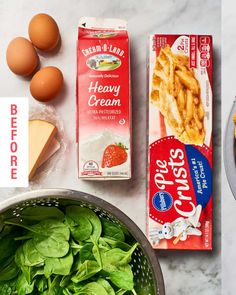 eggs, cheese and spinach are on the counter next to some other food items