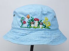 Item: mushroom embroidered bucket hat Material: 100% cotton Size: one size fits most Embroidery: hand made with acrylic thread Free first class shipping, upgradable priority mail service. 30 days return policy, feel confident at your purchase! Blue Cotton Bucket Hat For Outdoor, Custom Embroidered Cotton Summer Hats, Adjustable Embroidered Cotton Hat, Custom Embroidered Cotton Hats For Summer, Cotton Hats With Custom Embroidery And Curved Brim, Blue Cotton Bucket Hat For Festivals, Blue Bohemian Cotton Hat, Blue Cotton Festival Hat, Curved Brim Cotton Sun Hat For Festivals