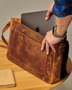 The Leather Messenger Bag for Men is a handmade bag designed to be the perfect daily companion for any man. Made of top-quality leather, the  briefcase laptop bag with some vintage look ensures the bag will last for years to come. The messenger bag comes in two sizes, with measurements of 13.75" x 9.75" x 2.3" (Small) and 15.3" x 11.75" x 2.9" (Large), making it capable of carrying a 13"-16" laptop. The adjustable shoulder strap is convenient to carry and can be adjusted from 43"-50" (110-127 cm Cheap Men's Laptop Bag For School, Men’s Leather Bag, Mens Leather Bag Work, Leather Wallet Mens Handmade, Lawyer Bag, Leather Bags For Men, Leather Shoulder Bag Men, Business Bags Men, Messenger Bag For Men