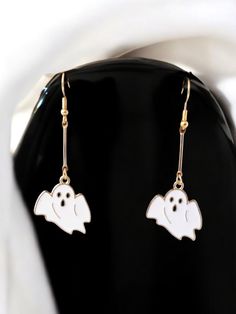 Get into the spooky spirit with these enchanting White Ghost Pendant Earrings just in time for Halloween! These fun and festive earrings feature charming white ghost pendants that will add a touch of whimsy to your Halloween outfit. Perfect for a costume party or just getting into the holiday mood, these earrings are sure to make a boo-tiful statement wherever you go. Add a playful and spooky touch to your Halloween ensemble with these adorable ghost earrings! White Halloween Party Jewelry, Spooky White Earrings For Party, White Spooky Earrings For Party, White Drop Earrings For Halloween, White Novelty Jewelry For Party, Novelty White Jewelry For Party, Spooky White Earrings For Halloween, White Novelty Party Jewelry, Spooky White Halloween Jewelry