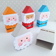 paper santa claus and other christmas decorations on a table