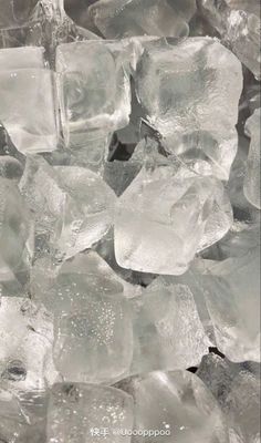 some ice cubes are sitting on top of each other