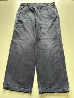 Mens Carhartt Baggy Carpenter Workwear Trouser / Pants 1990s vintage  Baggy Fit  Zip Fly  Navy Waist 36 inch Leg Length 30 inch **Sizes are exact measurement of the jean and may differ from the tag size** Please note due to the nature of these being workwear jeans there will be cool signs of fraying / paint and fading marks. All adding to the character of the piece** Item in great workwear condition overall Vintage Washed Wide Leg Pants, Vintage Wide Leg Washed Pants, Vintage Baggy Full-length Cargo Pants, Vintage Full Length Cargo Pants For Streetwear, Vintage Straight Leg Cargo Pants For Streetwear, Vintage Trousers For Streetwear, Vintage Full-length Bottoms For Streetwear, Vintage Baggy Cargo Pants, Vintage Straight Leg Work Pants For Streetwear