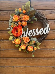 a wreath with flowers and the word closed on it is hanging on a wooden wall