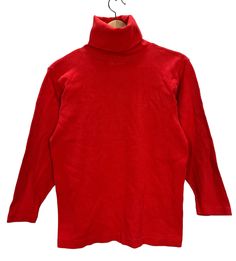 "Vintage sizes are different from modern sizes, often run much smaller, and differ from brand to brand. Please purchase based on measurements below and not based on tag size  DESCRIPTION This is a Vintage 90's Calvin Klein Red Turtleneck Long Sleeve T-Shirt. Fits like a Women's Small (please see measurements below to ensure a proper fit). Great design! CONDITION Vintage Preowned Condition - show signs of wear and fading due to age and normal use. There is a hole at the shoulder. Please see reference photos. MEASUREMENTS Underarm to Underarm: 16.5\" Top of Shoulder to Bottom Hem: 23.5\"  SHIPPING Item will be tightly folded. Please message us for International Shipping. International buyers are responsible for any import/duty fees their countries impose." Vintage Red T-shirt For Winter, Red Stretch T-shirt For Fall, Basic Cotton Turtleneck Top, Vintage Red Long Sleeve T-shirt, 90s Style Red Tops For Winter, Red 90s Style Winter Tops, Vintage Red Top For Winter, Vintage Red Tops For Winter, 90s Red Long Sleeve Tops