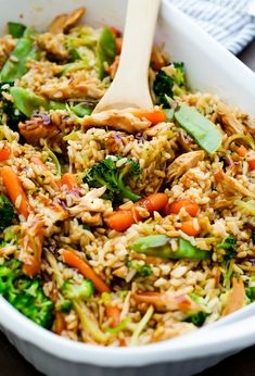 a close up of a plate of food with broccoli and rice in it