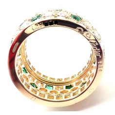 About This Piece: Metal: 18k Yellow Gold Size: European 52, US 6  Weight: 9.8 grams  Width: 13mm  Stones: Round brilliant cut diamonds VVS1 clarity, F-H color And Buff Top emeralds total weight approximately 5.50ct  Hallmarks: Cartier 750 52 627XXX(serial number omitted)   Please refer to the dimensions in the description above for accurate measurements. Please reach out to the seller with any questions on dimensions or fit prior to purchase. Luxury Multi-stone Emerald Ring With Diamonds, Cartier Cubic Zirconia Round Cut Jewelry, Cartier Diamond Ring With Accents For Gift, Cartier Rings In Yellow Gold With Pave Setting, Gold Cartier Jewelry In Cubic Zirconia, Cartier Cubic Zirconia Jewelry As Gift, Gold Cubic Zirconia Cartier Jewelry, Cartier Jewelry With Pave Setting In Round Cut, Cartier Round Cut Jewelry With Pave Setting