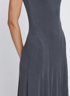 The Audrey Dress in Graphite is the epitome of timeless elegance and effortlessness. Crafted in a soft jersey stretch fabrication in a dark grey Graphite colourway. Featuring a high boat neckline and an a-line maxi silhouette, style for any occasion from day to night. Elevate the look with the Jasmin Sparrow Curve Hoops in Silver. Audrey Dress, Day To Night, Knitwear Tops, Boat Neckline, To Night, Occasion Dresses, Best Sellers, Timeless Elegance, Dark Grey