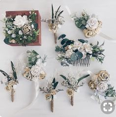 wedding flowers and hair combs laid out on a table