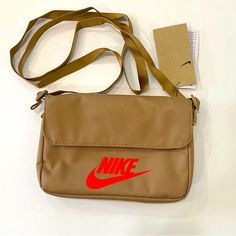 Nwt Small Nike Crossbody Bag. Outside & Inside Zipper Pocket. Button Closure & Outside Pocket Underneath Flap. 9”X 6” X 1.5”. No Flaws. New. Nike Crossbody Bag, Nike Accessories, Zipper Pocket, Nike Women, Crossbody Bag, Women Accessories, Nike, Zipper, Women Shopping